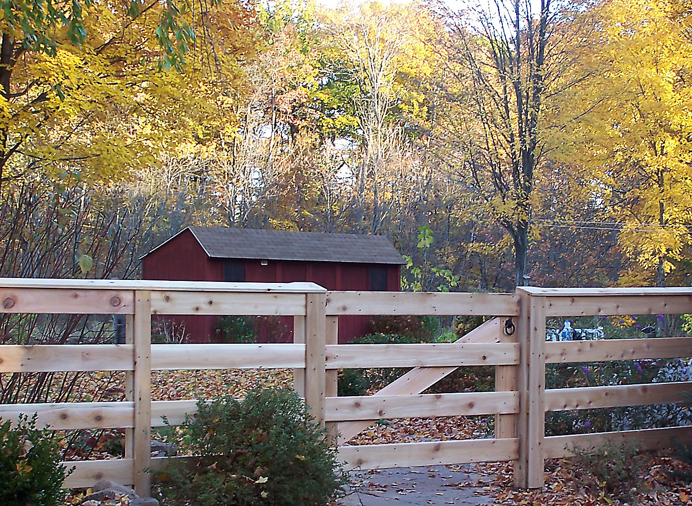Four-rail horizontal board fence in cedar installed by Arrow Fence in Connecticut